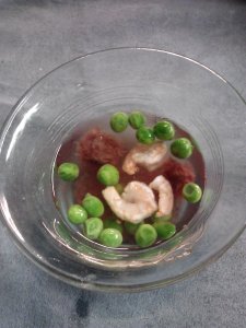 Treat your fish once in awhile. Here's a bowl of peas, brine shrimp and cocktail shrimp.